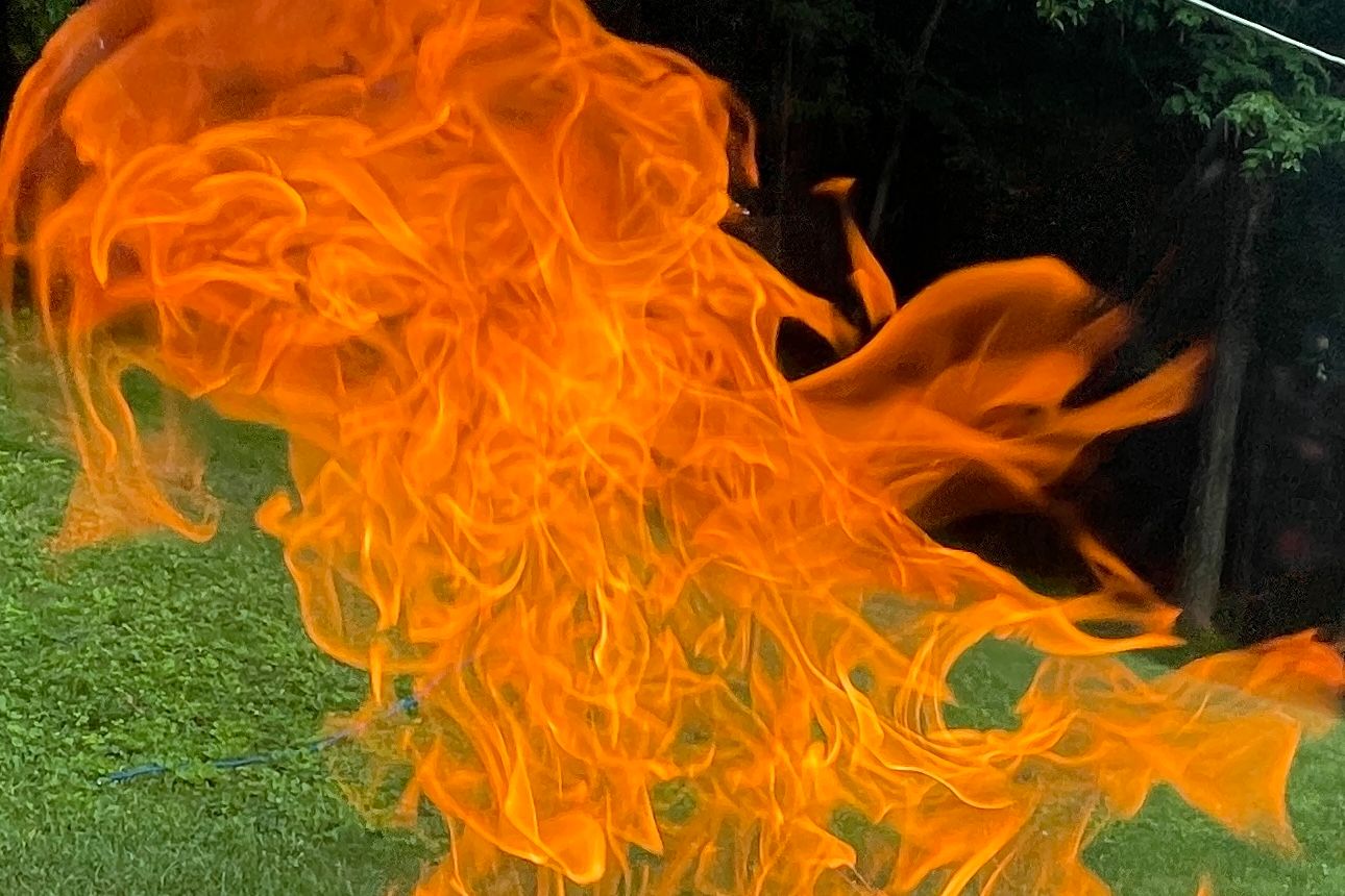 Flames set against a yard