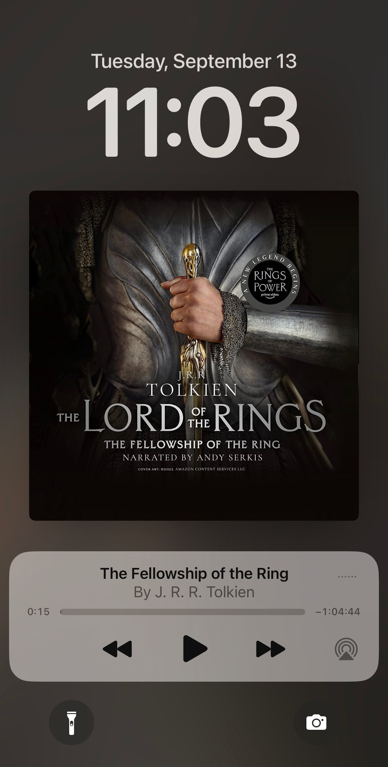 An iOS screenshot featuring an audiobook cover of Fellowship of the Ring.